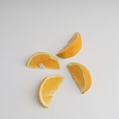 Sliced oranges on white background