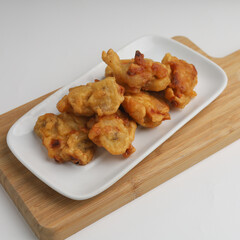 Banana fritters in a plate on white background