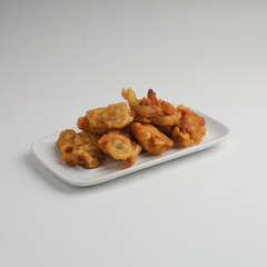 Banana fritters in a plate on white background