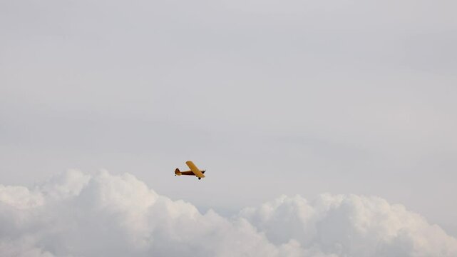 Vintage Piper Cub Soaring Above Geelong Clouds