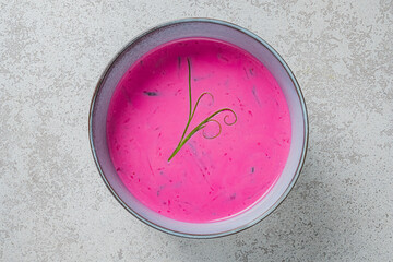 Bold pink beetroot soup with herb garnish delights the senses at any meal