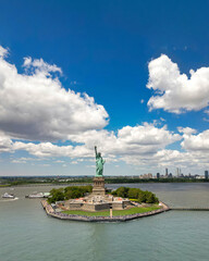 New York City with statue of liberty photo from drone. Aerial view of statue of liberty skyline in Manhattan. NYC, NY. Cityscape near statue of liberty. Famous statue of liberty of New York. © Volodymyr