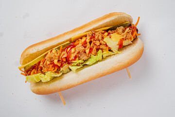 Savor a flavorful hot dog topped with fresh veggies and savory toppings, ready to enjoy!