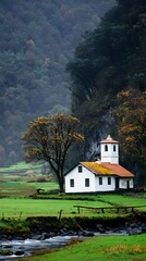 Obraz premium Peaceful rural landscape with a small white house