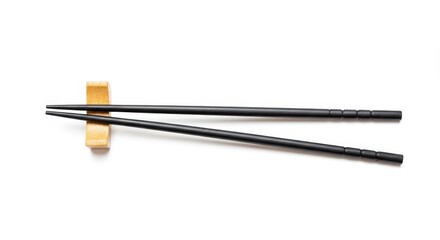 Isolated Photo of Black Chopsticks Resting on a Wooden Holder on White
