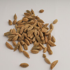 Cardamom on wood background