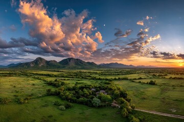 Fototapeta premium Dreamy Landscape Underneath Colorful Clouds in Dusk