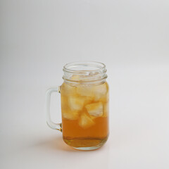Iced tea in a glass on white background