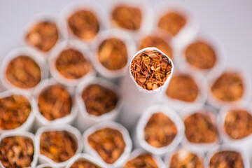 Burning cigarette with smoke and concept of cigarettes 
