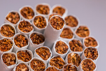Burning cigarette with smoke and concept of cigarettes 