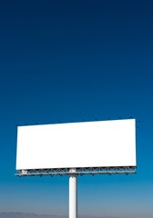 Fototapeta premium Photo of a Bright White Billboard with Blue Sky Background Advertising Space