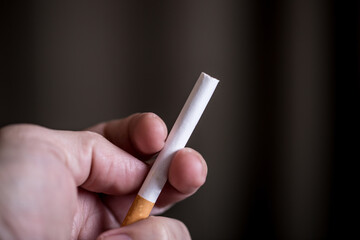 Burning cigarette with smoke and concept of cigarettes 
