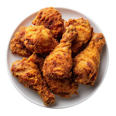A top view of a white plate piled high with golden crispy fried chicken pieces on a transparent background