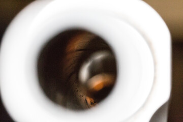 Macro view of weapon barrel with bullet at the end