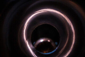 Macro view of weapon barrel with bullet at the end