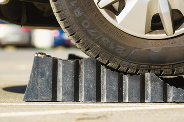 Camper using leveling block for level