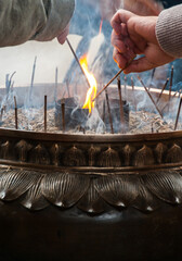 Incense being lit