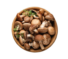 fresh organic cremini mushrooms in wooden bowl