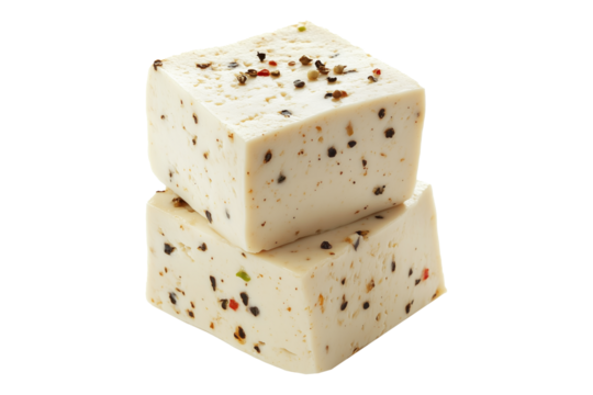 Cubes of seasoned tofu with visible herbs and spices, arranged in stack isolated on white transparent background, concept of healthy vegetarian protein option