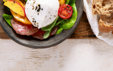 Salad with burrata cheese, lettuce and tomatoes