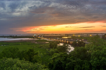 Obraz premium Aerial view of Mobile Bay at sunset