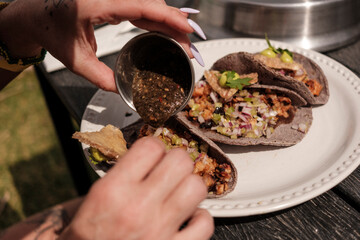 Adding Salsa to Grilled Tacos