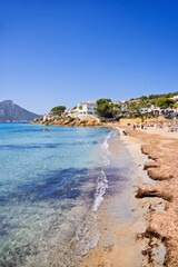 Sand beach in a coast village on Mallorca a sunny summer day