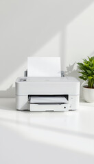 Modern printer with blank sheet ready to print, surrounded by green plant, exudes clean