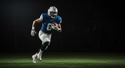Photo of Football Player in Action Running Across Green Field at Night