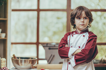 Future Master Chef – Determined 9-Year-Old Boy in Mini Chef’s Coat for Kids Take Over Kitchen Day (Perfect for Cooking Schools, Kids’ Culinary Kits & Aspiring Chef Content)