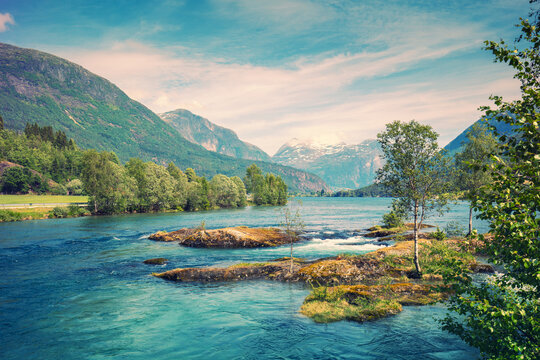 Beautiful Stryn River. View from the Lunde Bridge. Cascade mountain stream with rapids. Stryn, Norway