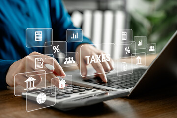 Businesswoman analyzing virtual tax data on laptop computer, modern financial technology with digital tax calculation, accounting system, and virtual finance management for business and investment.