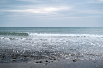 Waves at the Beach on a cloudy Day