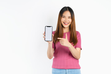 Fototapeta premium Smiling asian woman holding smartphone with blank screen for advertise on white background.