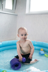 toddler bathes in the pool