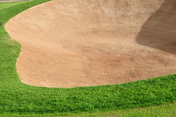 Golf Course Sand Pit Bunkers, green grass surrounding the beautiful sand holes is one of the most challenging obstacles for golfers and adds to the beauty of the golf course