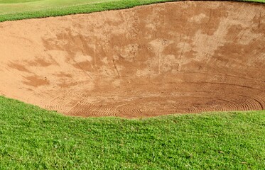 Golf Course Sand Pit Bunkers, green grass surrounding the beautiful sand holes is one of the most challenging obstacles for golfers and adds to the beauty of the golf course