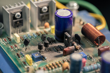 Close up shot, amplifier circuit board is burnt, damaged, Some components on the circuit board are...
