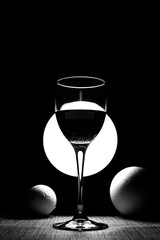 Still life with wine glass and foam balls	