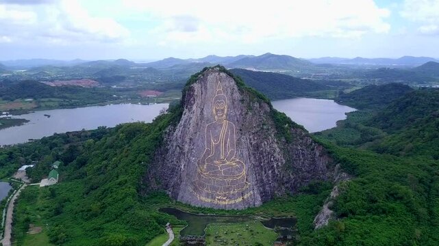 Buddha statue carved on the cliff face of Khao Chee chan Khao Chion, Pattaya, Chonburi, Thailand