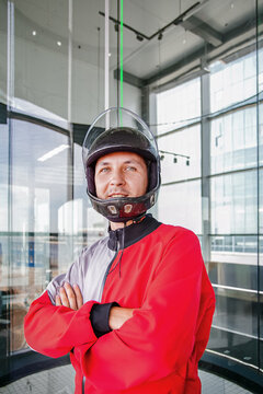 Indoor skydiving instructor prepares for a flight experience session