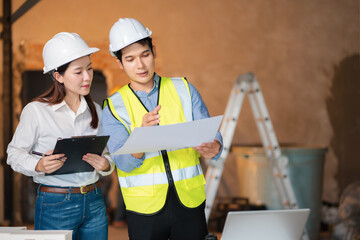 Fototapeta premium Engineering Team Collaborates on Blueprint Model in Corporate Office.