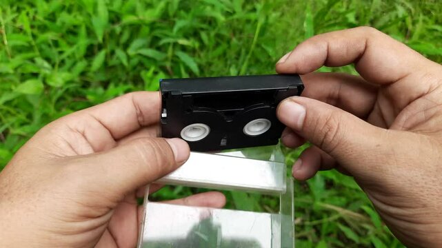Person Holding Mini DV Cassette Tape