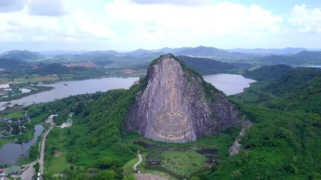 Buddha statue carved on the cliff face of Khao Chee chan Khao Chion, Pattaya, Chonburi, Thailand
