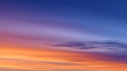 Fototapeta premium Vibrant blue and orange gradient sky blending smoothly, evoking a sense of serene harmony and boundless energy