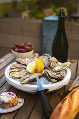 Fresh Raw Oysters with Citron, Baguette, Butter, and Cider