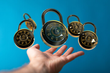 High-quality image of combination locks floating towards a hand, symbolizing digital security and...