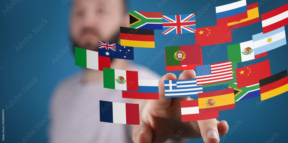 Poster Image of a man interacting with a digital display of various world flags, representing global communication and connection.