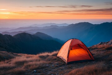 camping tent high in the mountains at sunset