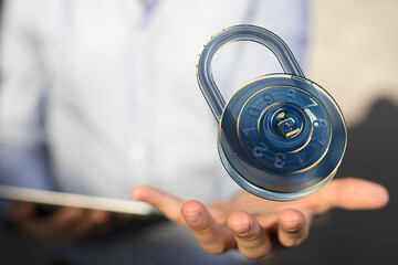 Secure your data.  Cybersecurity concept image. Holographic padlock in hand.
